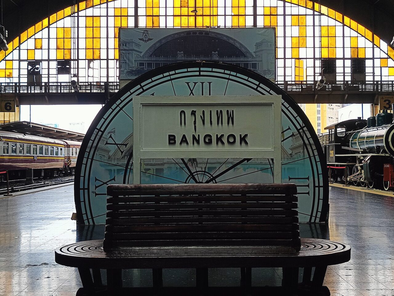 Platform nameboard reading krung thep in Thai script above BANGKOK in roman letters at Hua Lamphong railway station in Bangkok Thailand