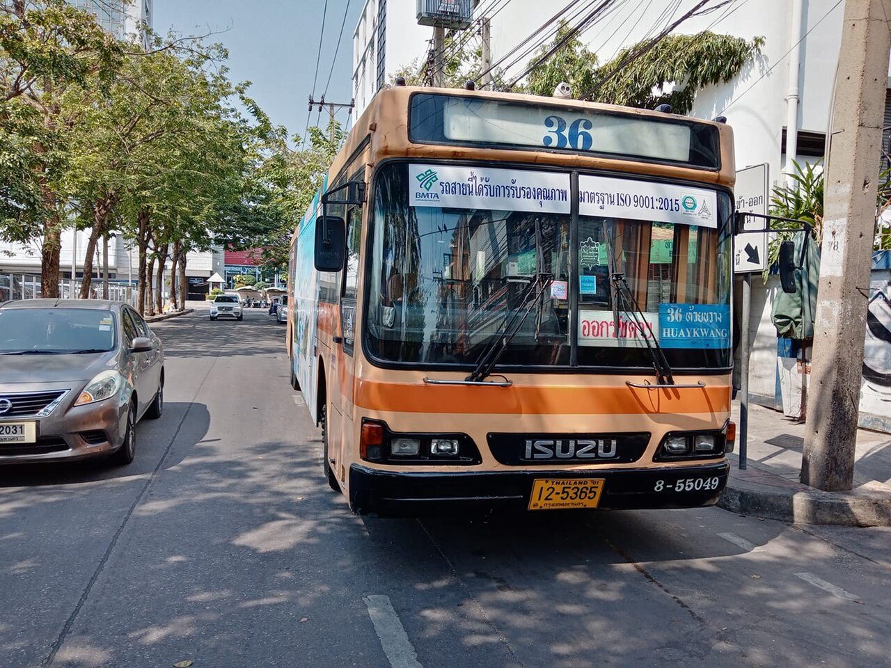 Air conditioned BMTA bus number 36 in Bangkok with a blue windscreen card reading Huai Khwang in Thai script above the transliteration HUAYKWANG